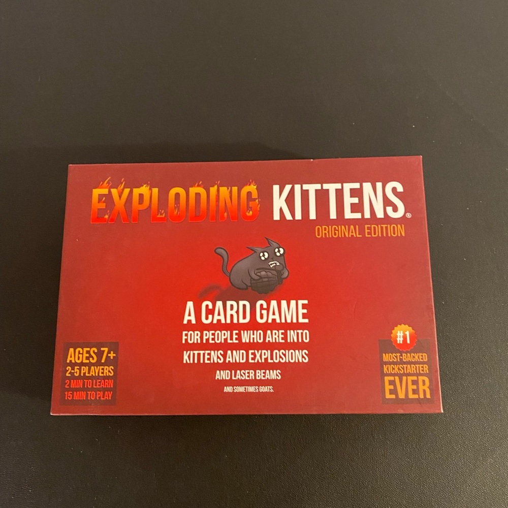 Exploding Kittens card game.  EUC